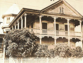 a large house with pillars